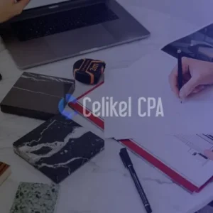 Business documents on a desk with a hand pointing, symbolizing corporate legal decision-making. Focuses on the choice between Limited (LTD) and Joint Stock (JSC) company types in Turkey for 2025.